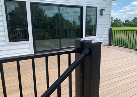 MARVIN ELEVATE EBONY WINDOWS & SLIDING DOOR, FIBERON BROWNSTONE DECKING WITH WESTBURY TUSCANY BLACK RAILING