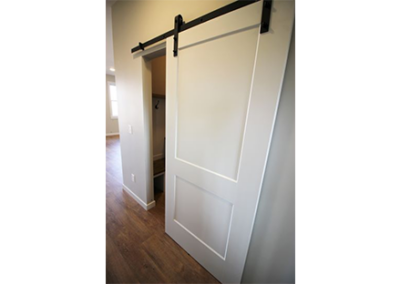 SOLID CORE, 2 PANEL BARN DOOR WITH BENT BLACK METAL STRAPÂ 