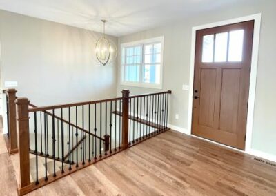 ThermaTru  Door & LJ Smith Stair System with Maple Newels & Handrails